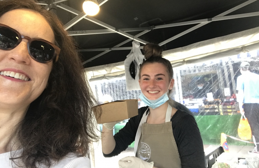 Theresa Villiers buying lemon drizzle cake in Barnet Market