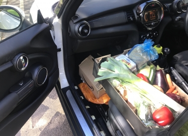 Theresa Villiers drops off food for residents in Station Road