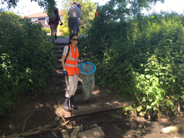 Theresa Villiers helping with a litter-pick by Dollis Brook